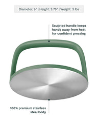 Caraway grill press handle close-up demonstrating comfortable grip and safety