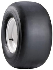 Carlisle smooth tire front view showing tread and size, ready for replacement