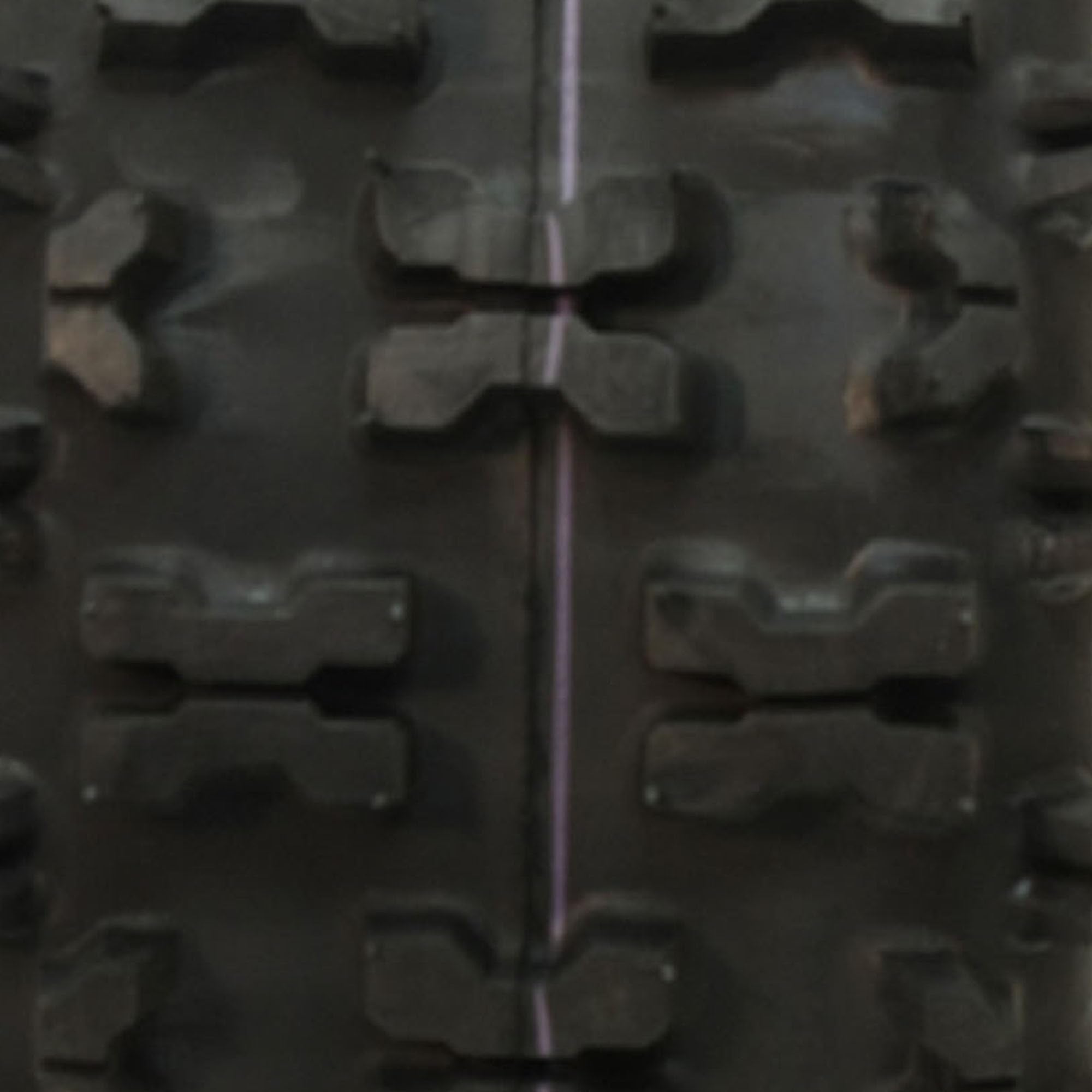 Carlisle Snow Hog tread closeup highlighting X-pattern for better traction