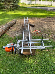 Carmyra 9-foot rail guide full length on log, ensures straight level first cuts