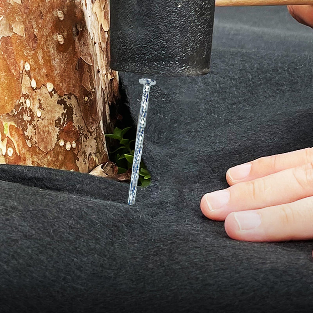 CAROYINO stakes installed along artificial turf edge providing secure, wind-resistant hold