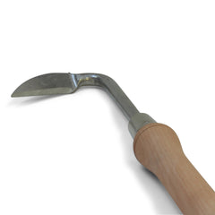 Carrot Design weeder in garden use removing a dandelion for effortless extraction