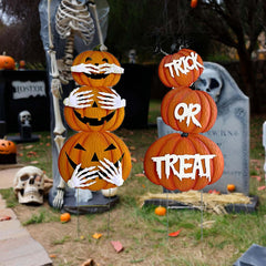 Cbumane front view of two stacked pumpkin stakes showing rustic finish and glow benefit
