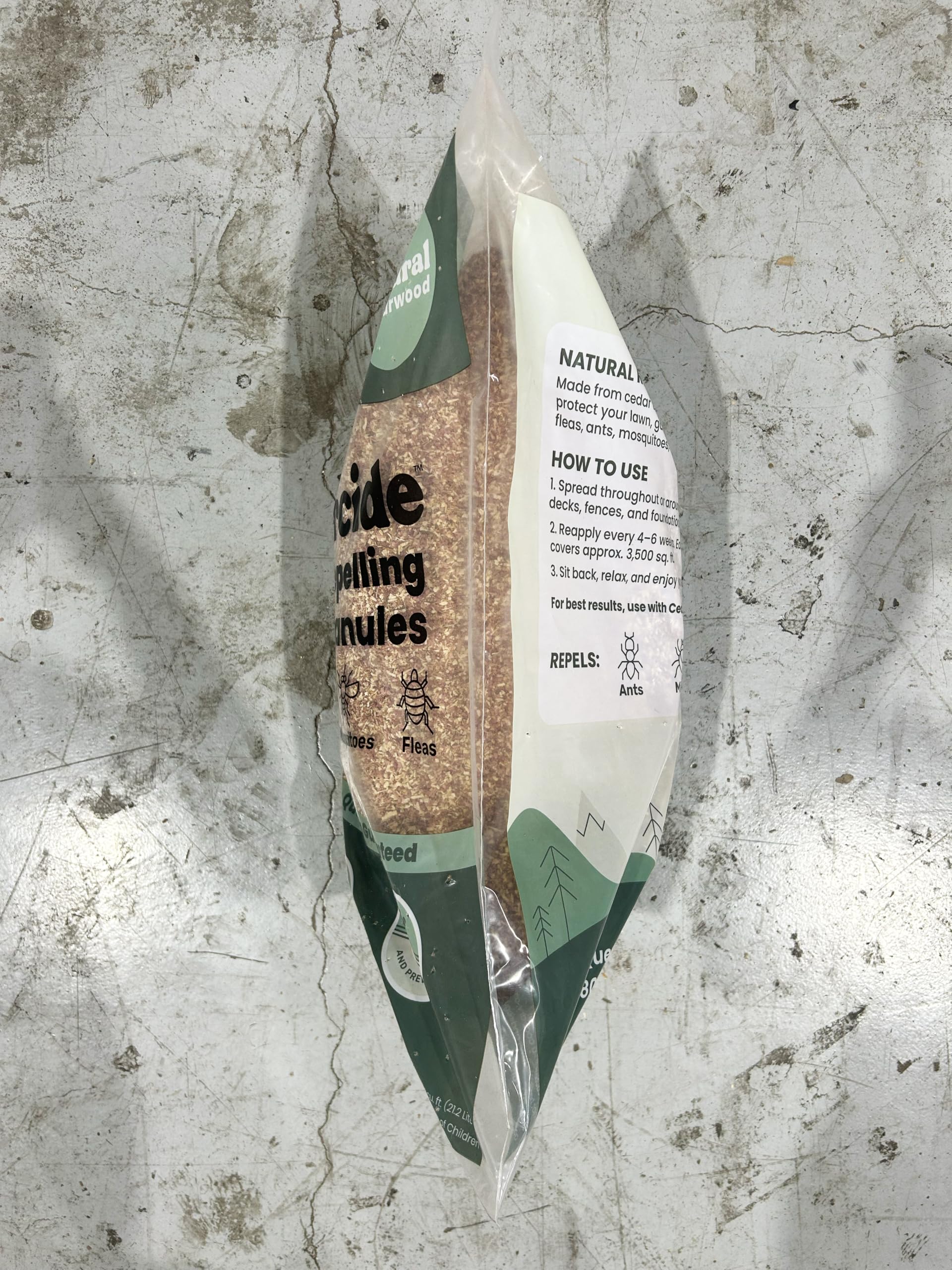 Cedarcide granules placed in a shed corner illustrating odor control and insect deterrence