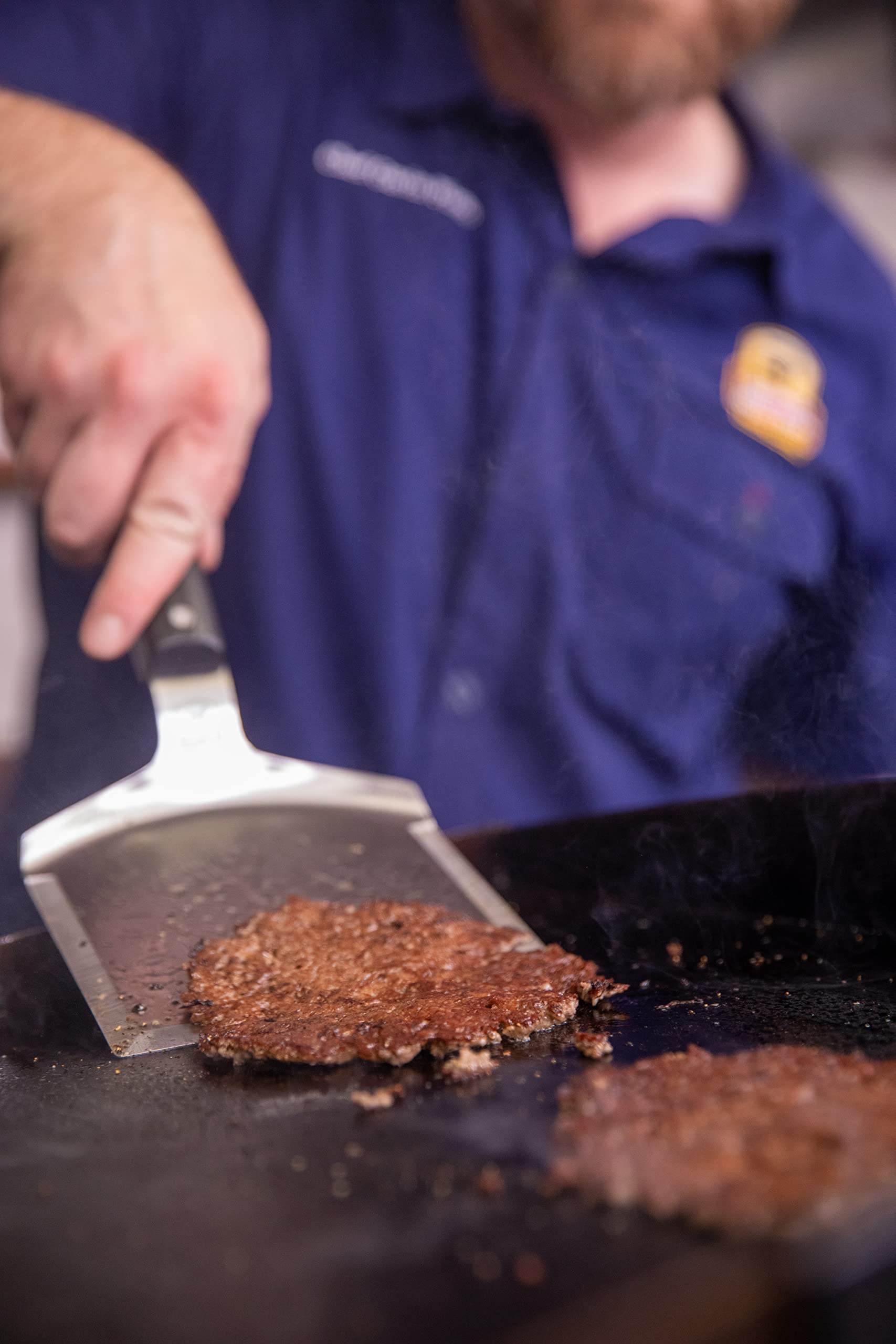 Certified Angus Beef spatula leather loop hanging on a hook for convenient storage