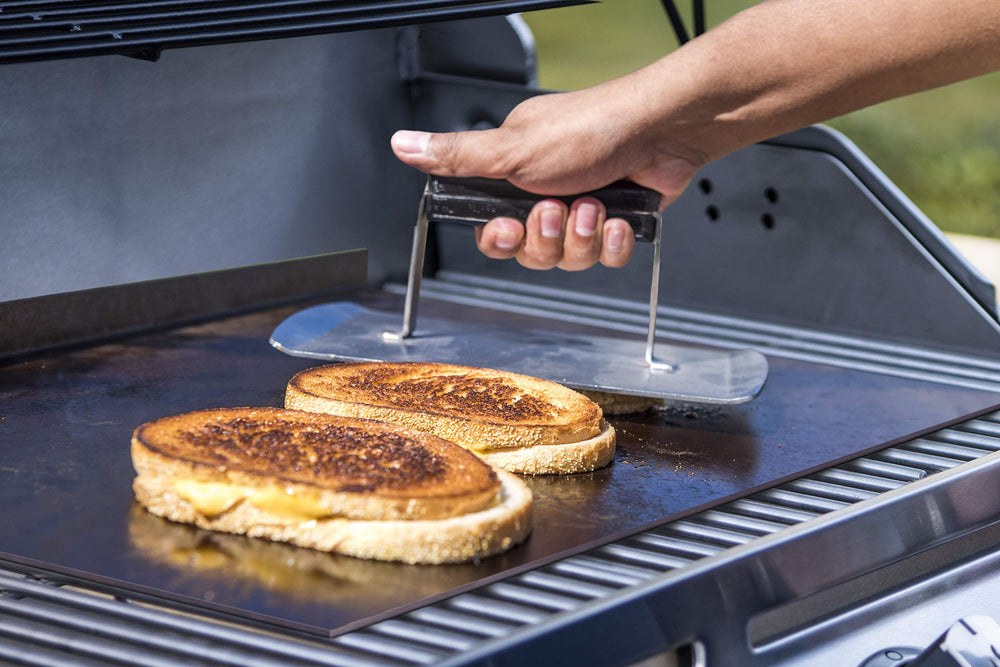 Char-Broil griddle stone in grill cooking eggs and vegetables for versatile meals