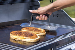 Char-Broil griddle stone in grill cooking eggs and vegetables for versatile meals