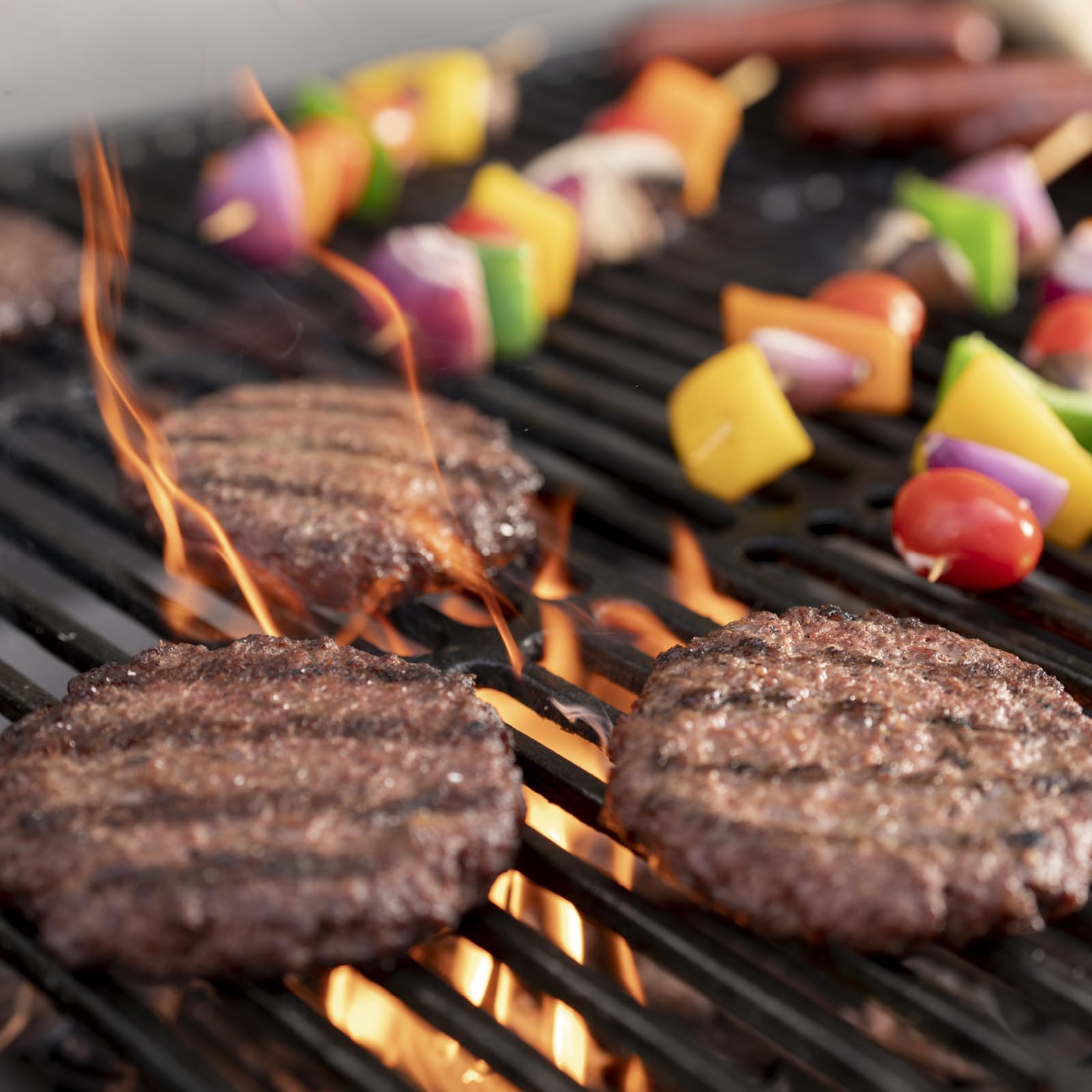 Close-up of Char-Griller cast-iron grates highlighting durable heat retention and sear marks