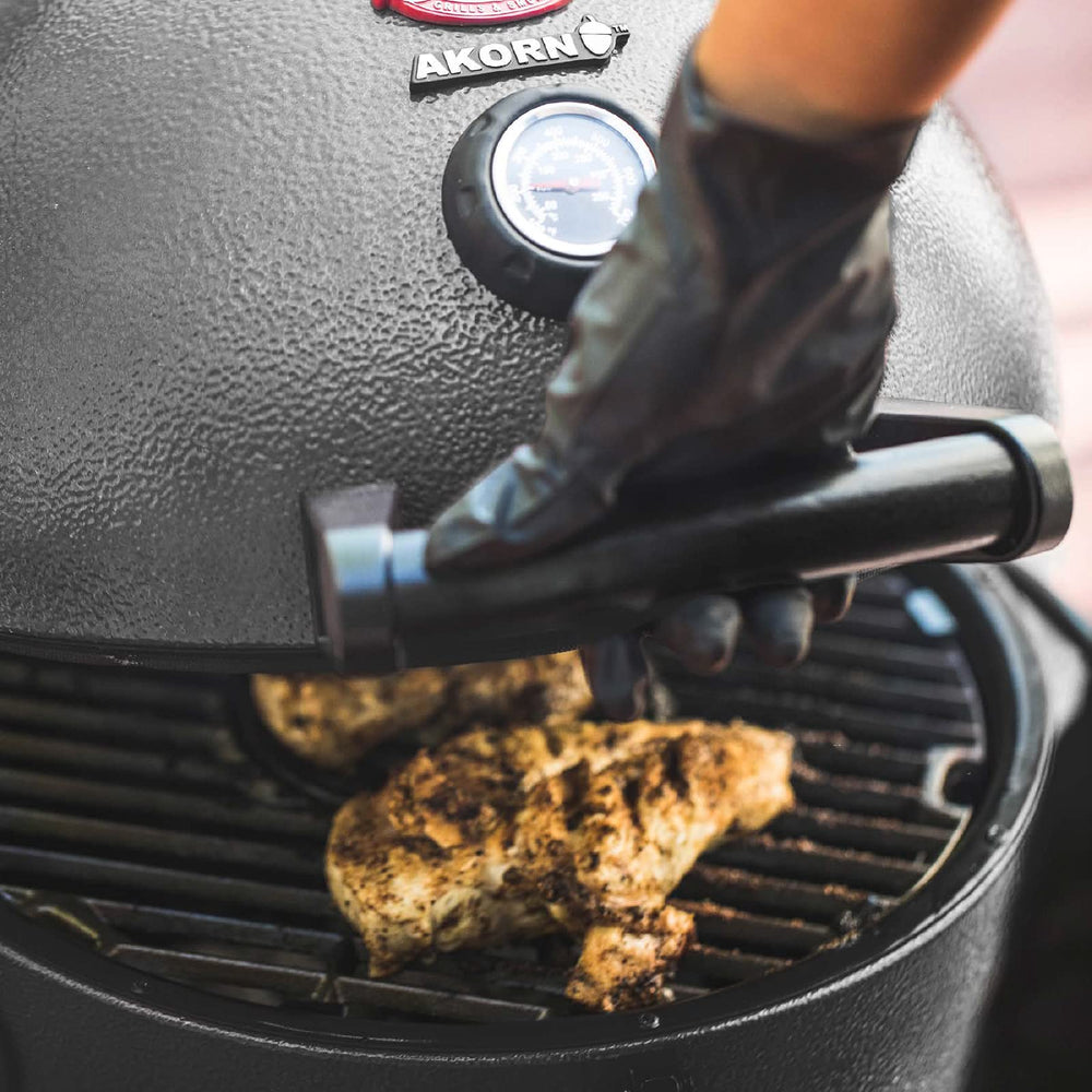 Char-Griller Smokin' Stone in backyard kamado setting highlighting versatility