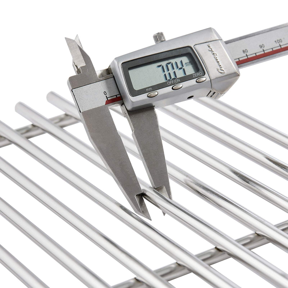 Charbrofire grates beside measuring tape to show 18 1/16" length accuracy