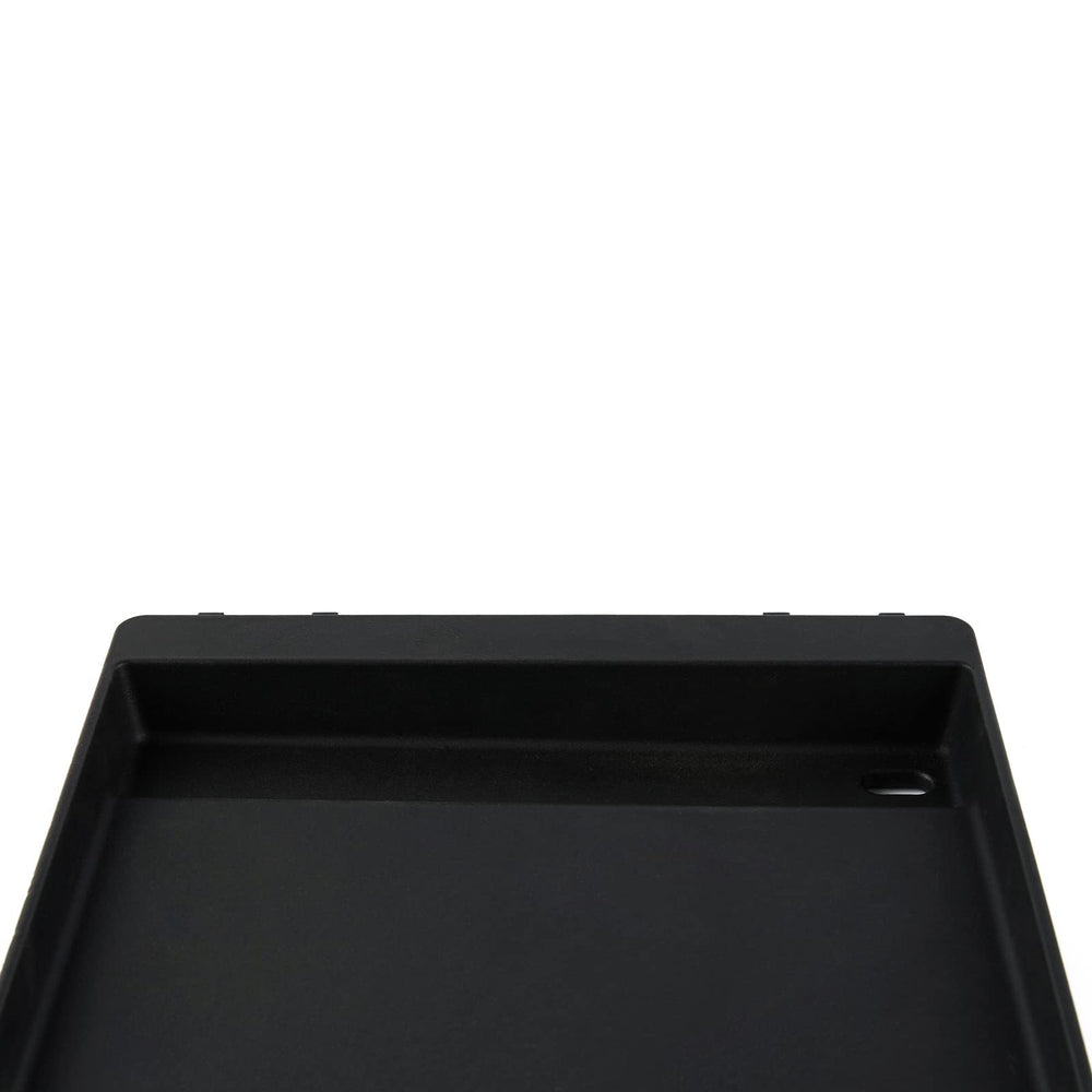 Charbrofire griddle being wiped and lightly oiled to show easy maintenance