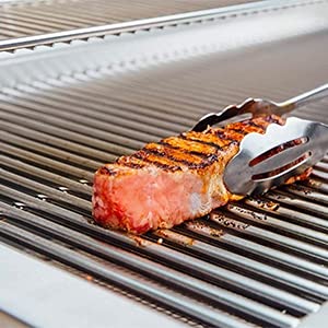 Charbrofire lifestyle shot of backyard grill using grates for reliable cooking