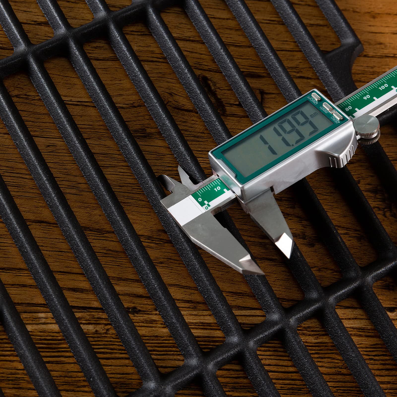 Charbrofire grates beside a ruler illustrating exact dimensions for correct fit verification