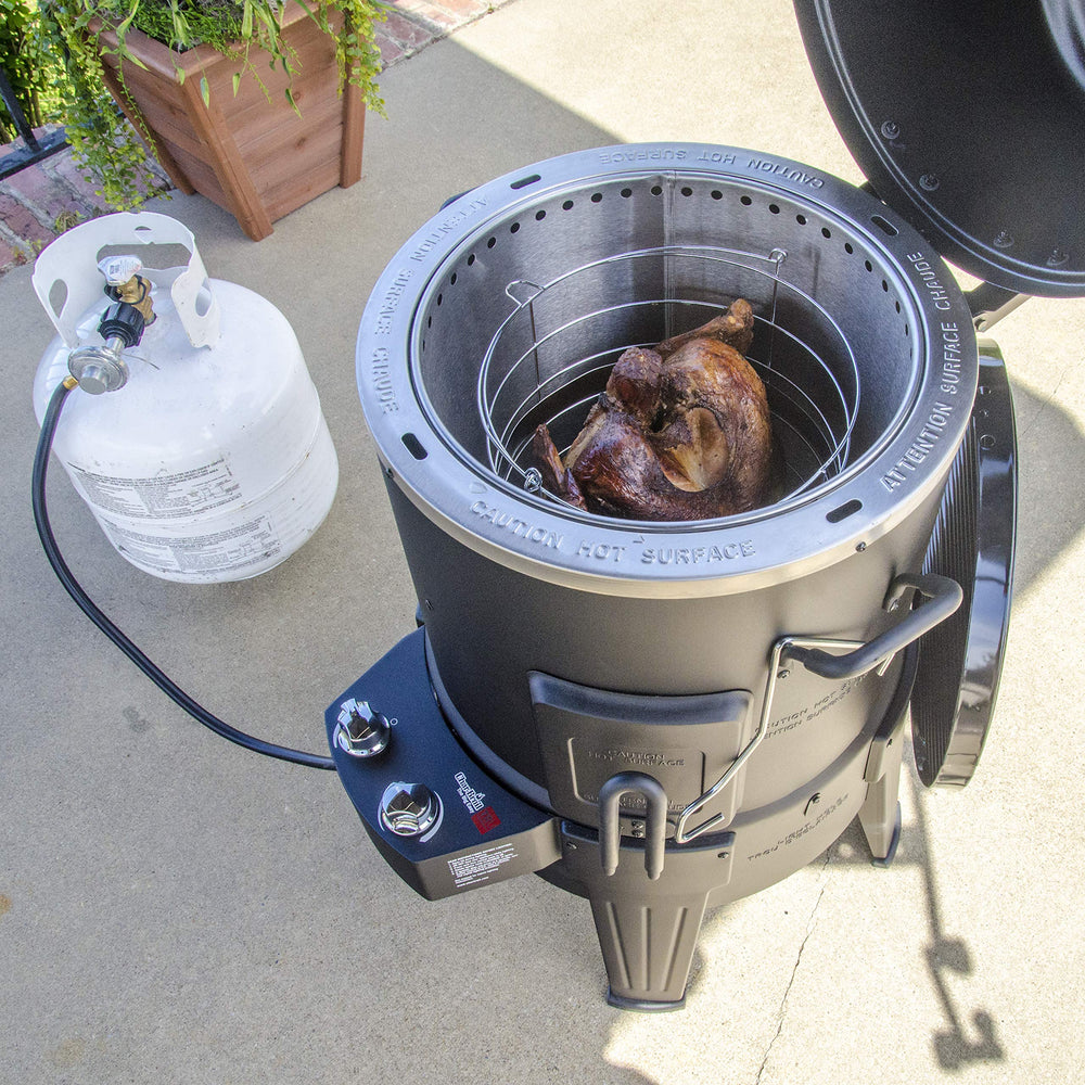 Charbroil Big Easy next to a turkey for scale showing family-size cooking benefit