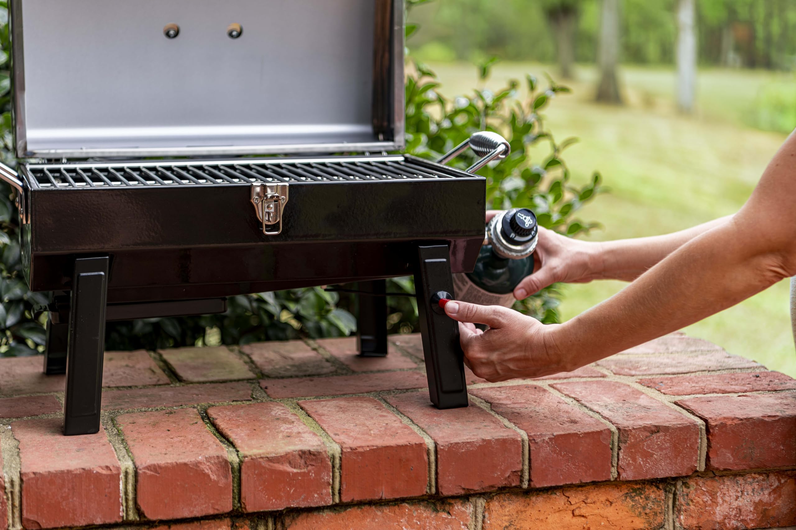 Charbroil in use at beach picnic demonstrating portable grilling convenience