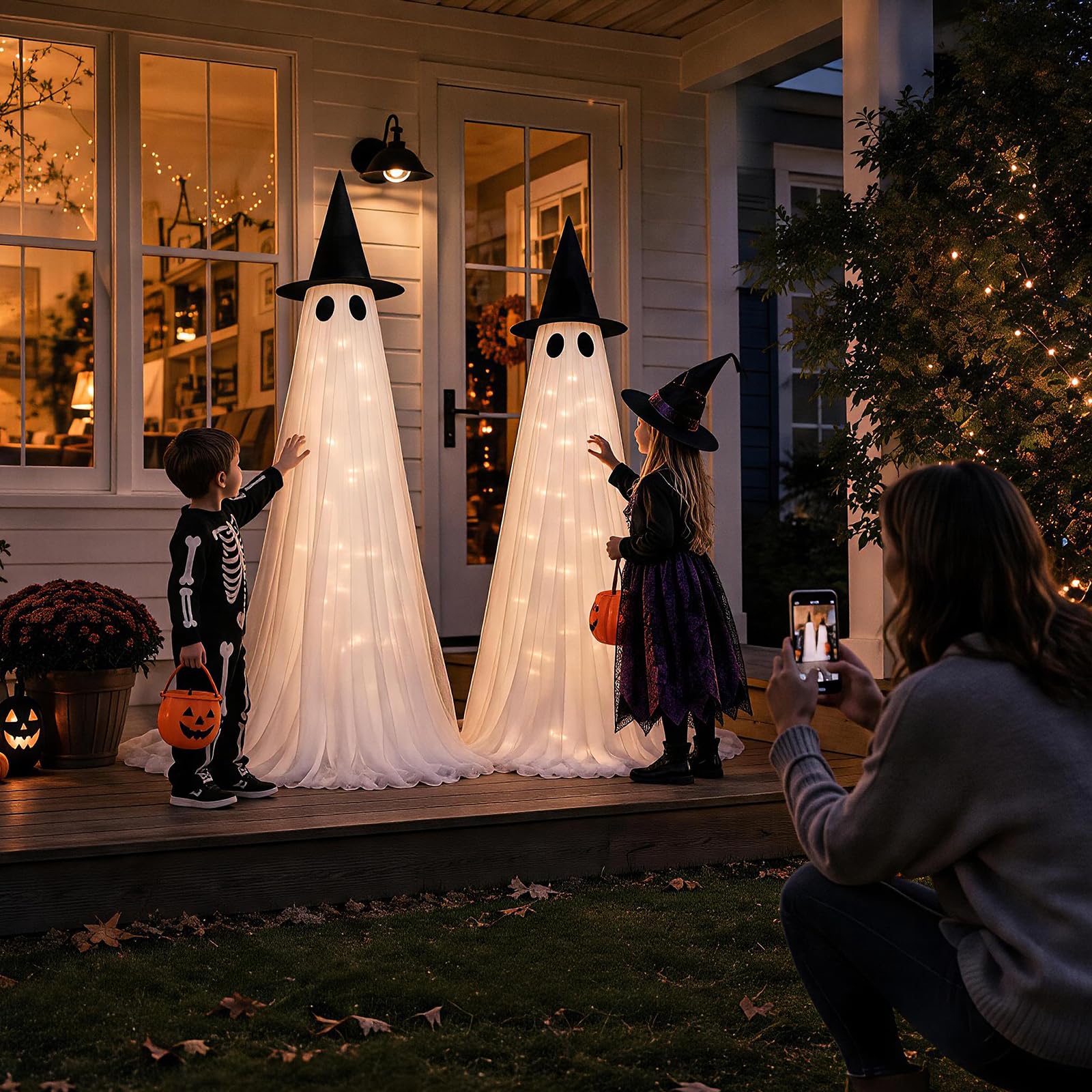 CheerBloom lit ghosts on porch at night creating warm inviting glow