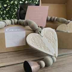 Cherish Gift Co. sympathy poem card beside chime conveying heartfelt message