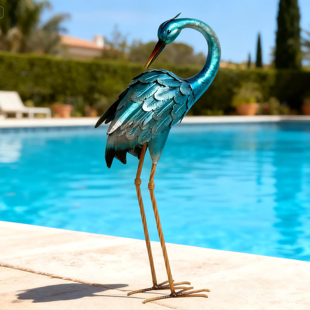chisheen heron in garden setting provides decorative height and visual interest to beds