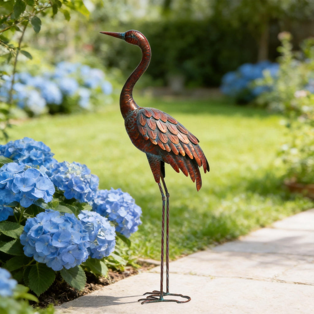 chisheen crane next to outdoor chair demonstrating size and visual scale in yard