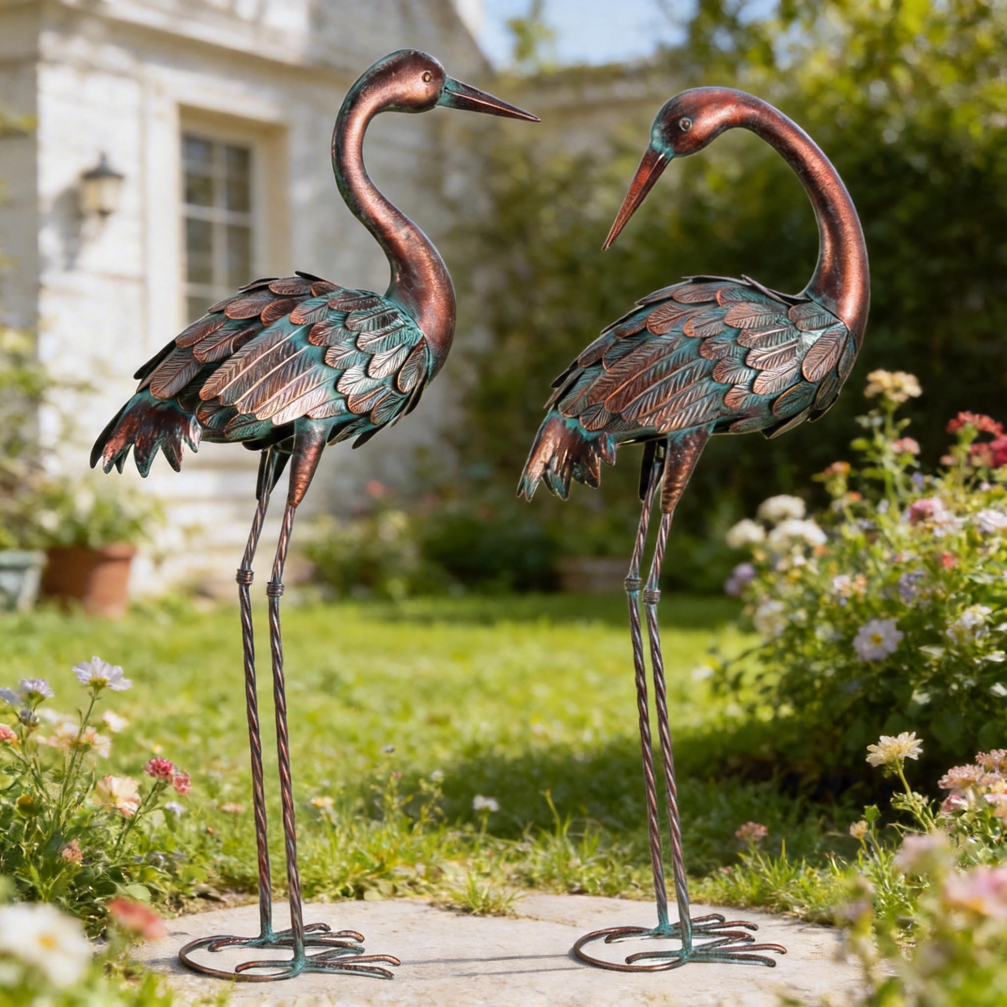 chisheen front view of both crane statues showing elegant yard focal point benefit