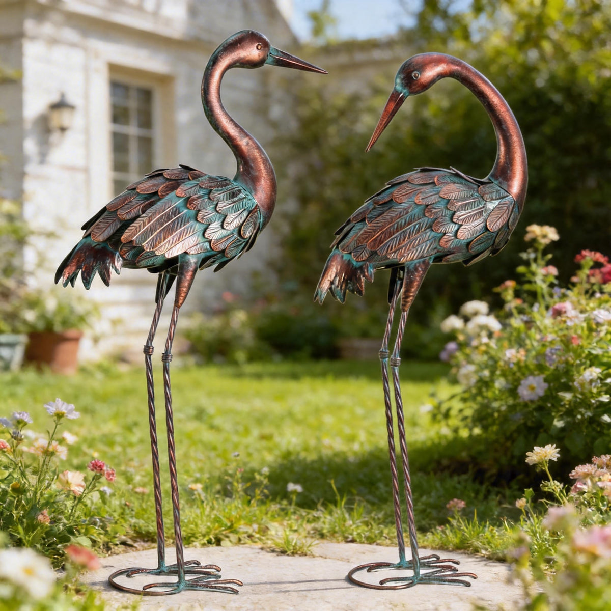 chisheen front view of both crane statues showing elegant yard focal point benefit