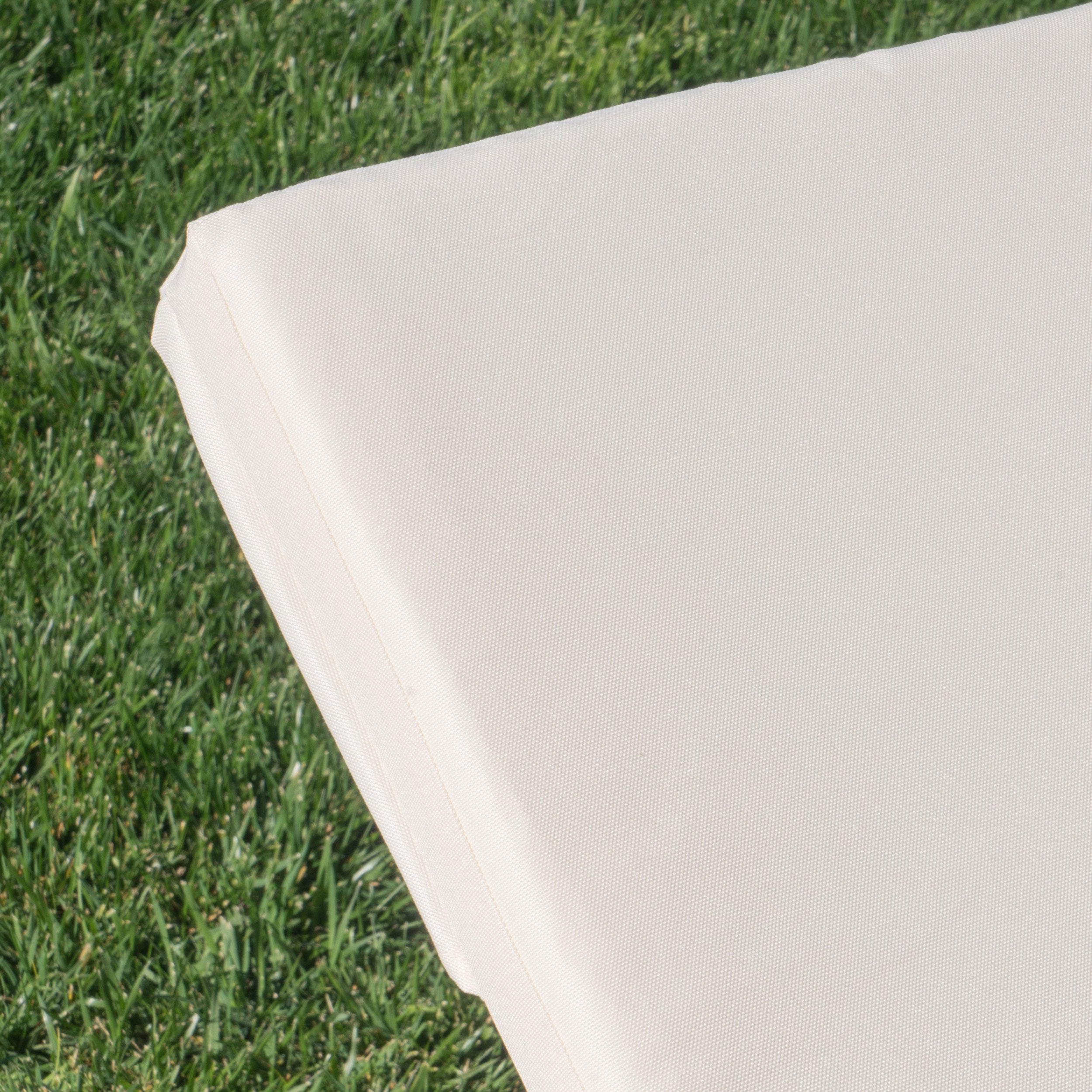 Christopher Knight Home pair of cream cushions next to packaging for easy setup advantage