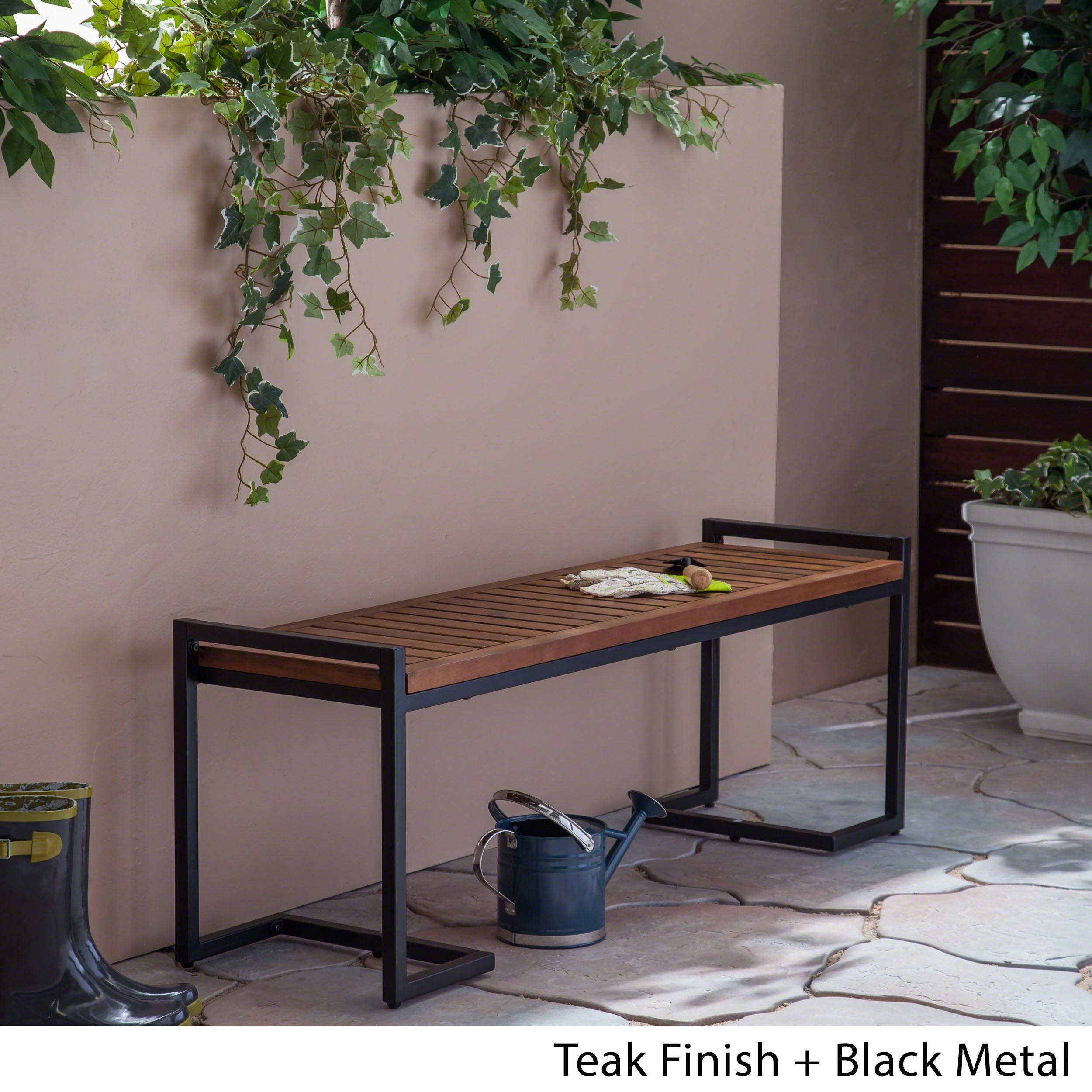 Christopher Knight Home iron leg detail showing cantilever support and stable design