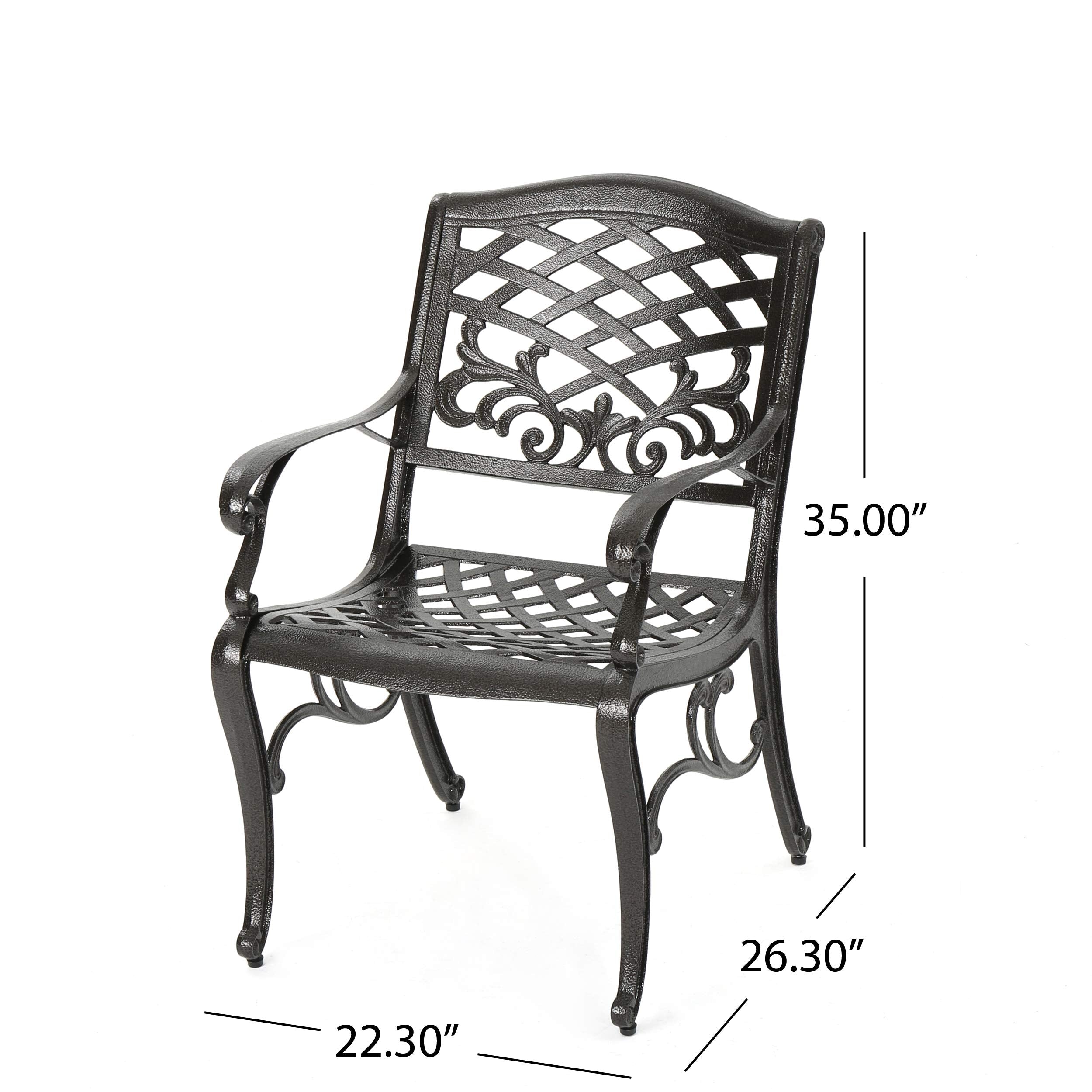 Christopher Knight Home pair of Sarasota chairs staged on patio conveying elegant outdoor dining ambiance