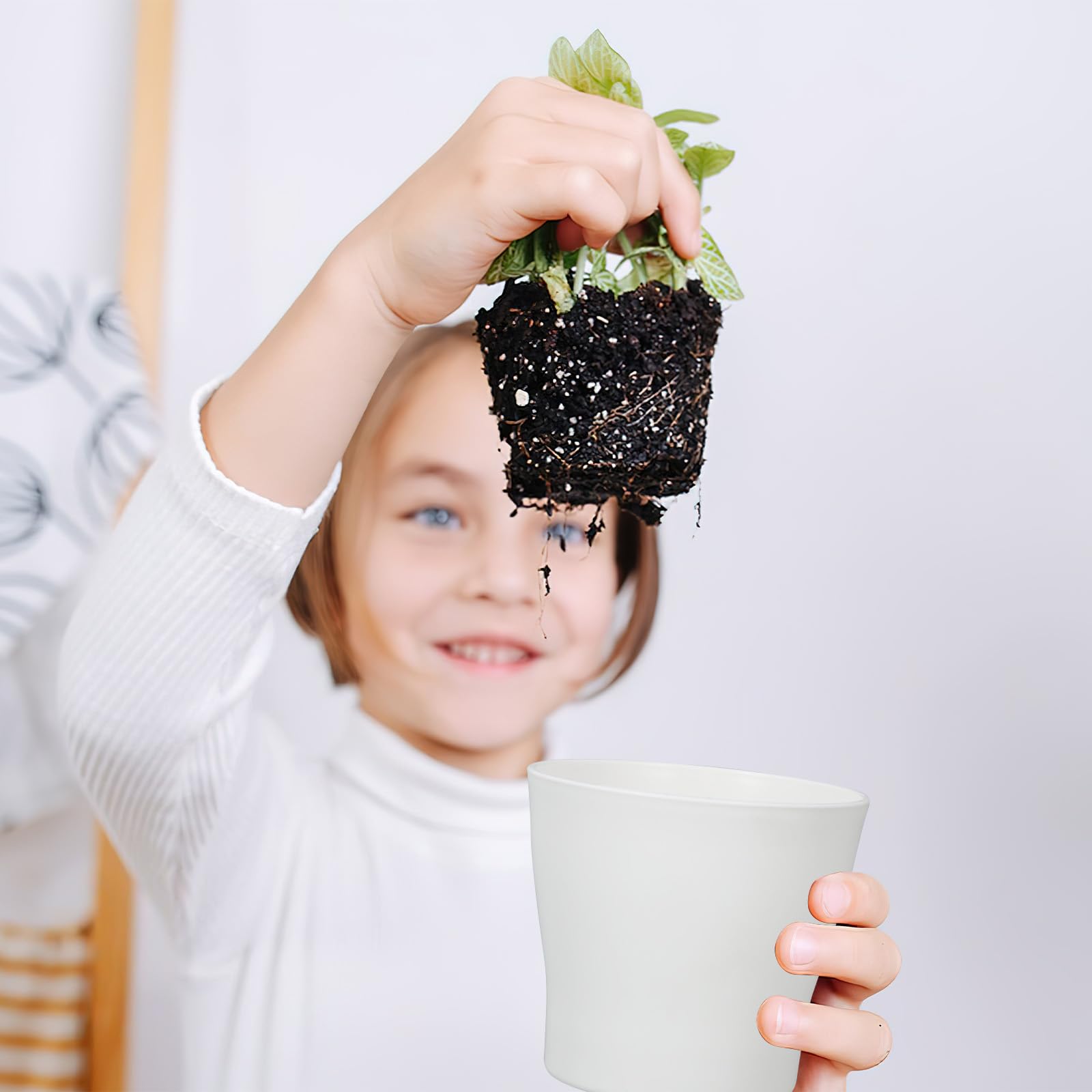 CIEOVO classroom scene with children painting pots and learning gardening