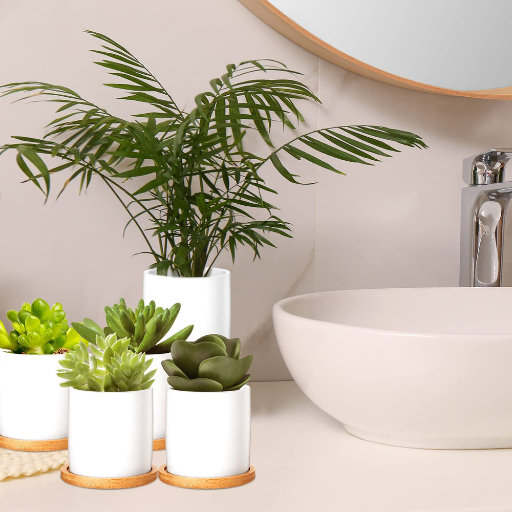 Cindeer pot held in hand to show 3-inch scale and compact tabletop fit