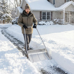 Cinnvoice shovel in use pushing snow on a driveway for faster cleanup