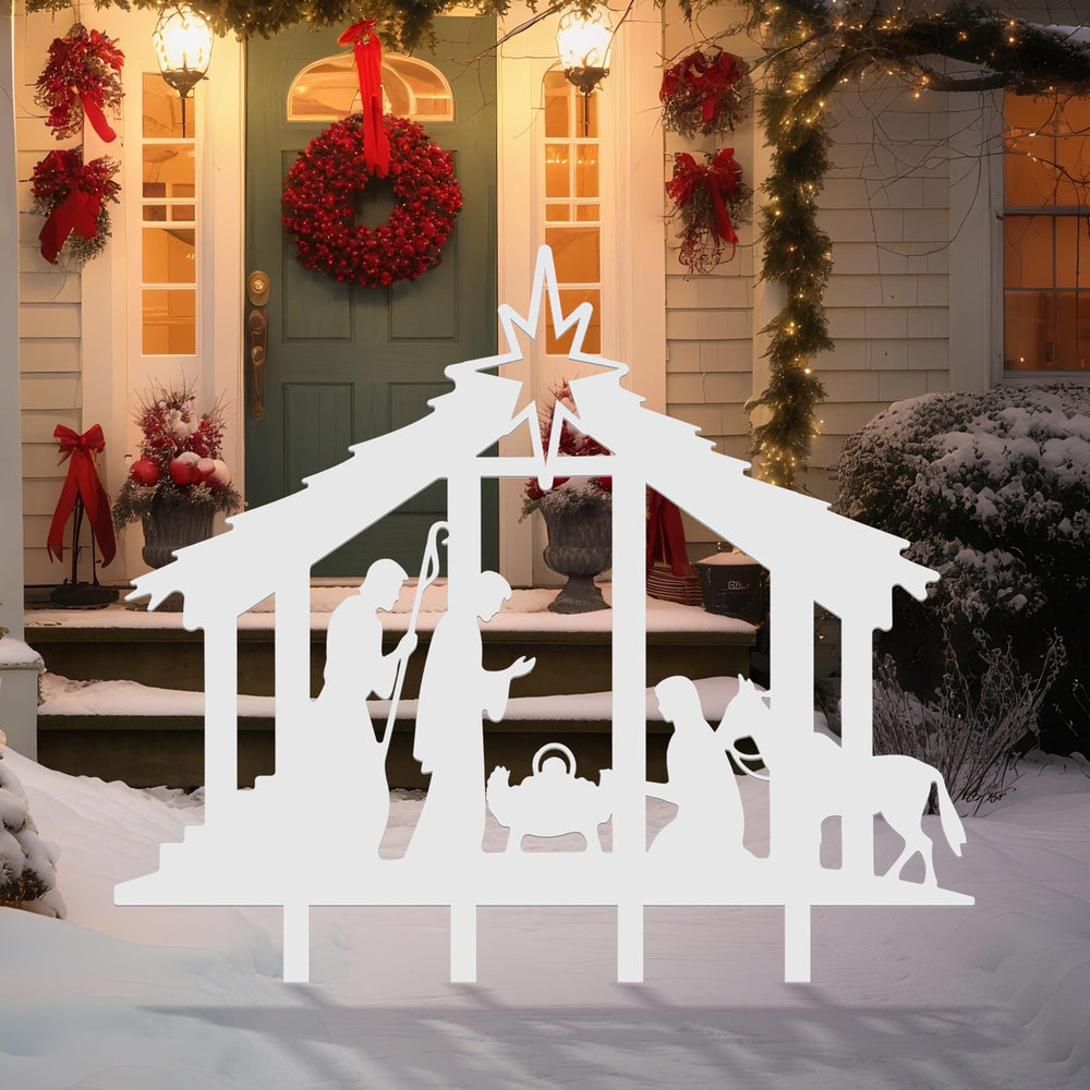 Cinnvoice nativity installed in a yard with spotlight showing strong nighttime visibility