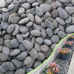 CJGQ front pile of river rocks showing full bag, durable landscaping finish