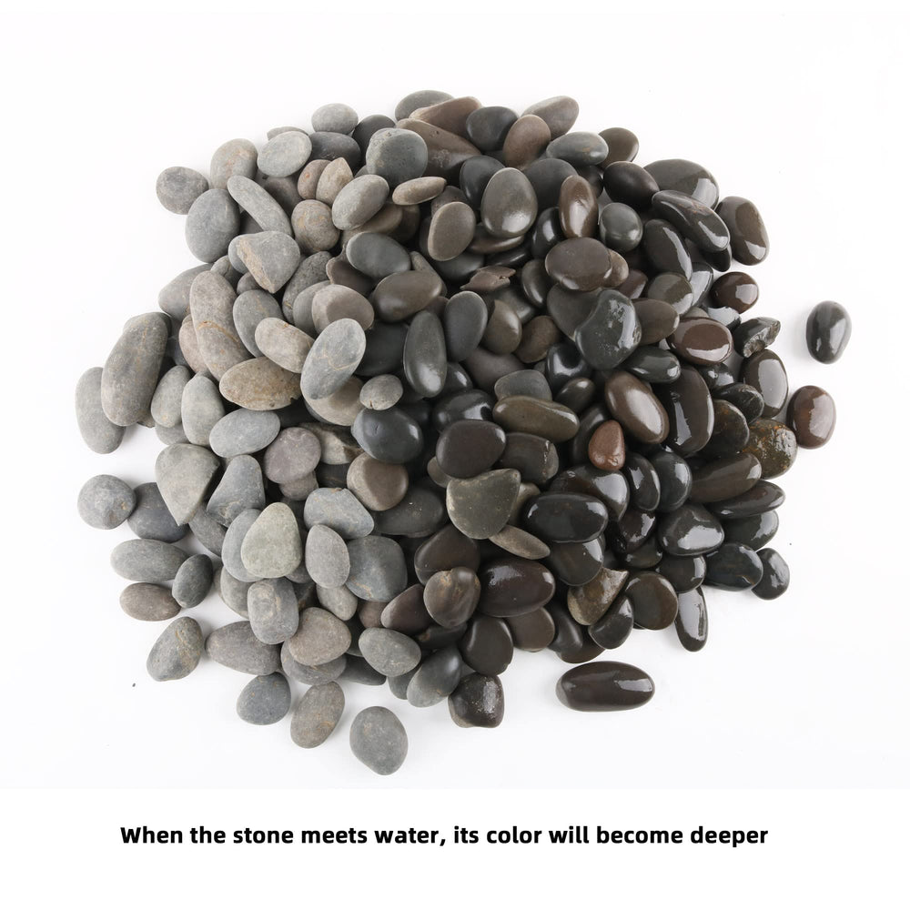 Hand holding a CJGQ pebble to show 1-inch scale and easy placement benefit