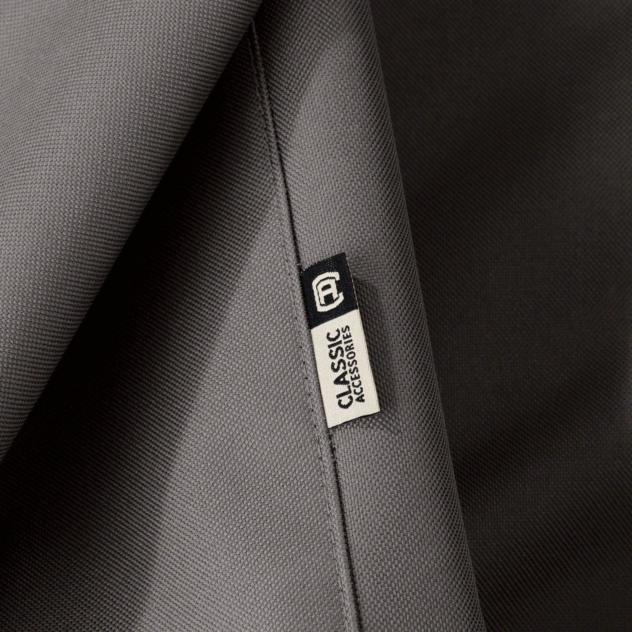 Classic Accessories Ravenna cover in backyard setting protecting furniture from sun and rain
