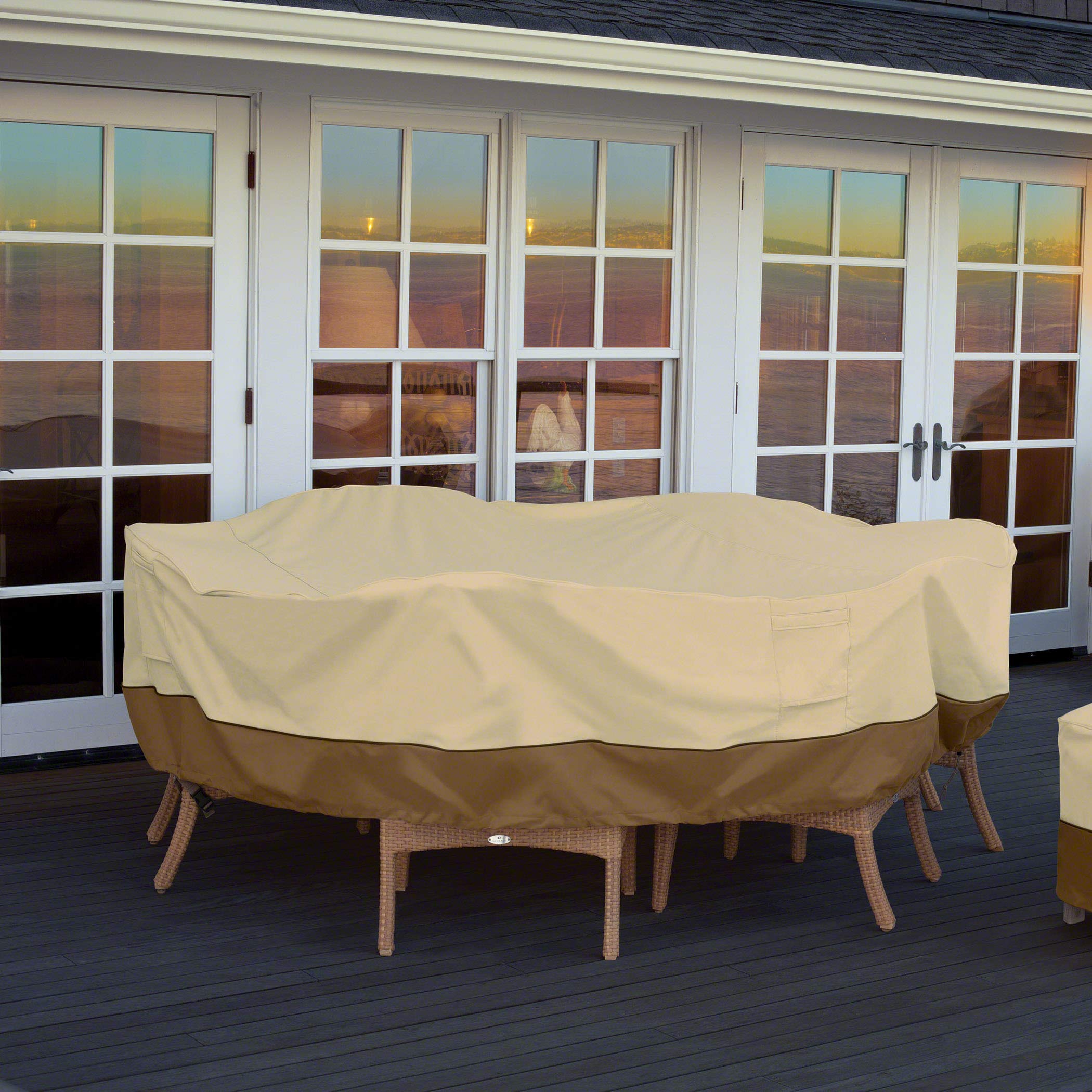 Classic Accessories cover on patio table set in backyard demonstrating protection