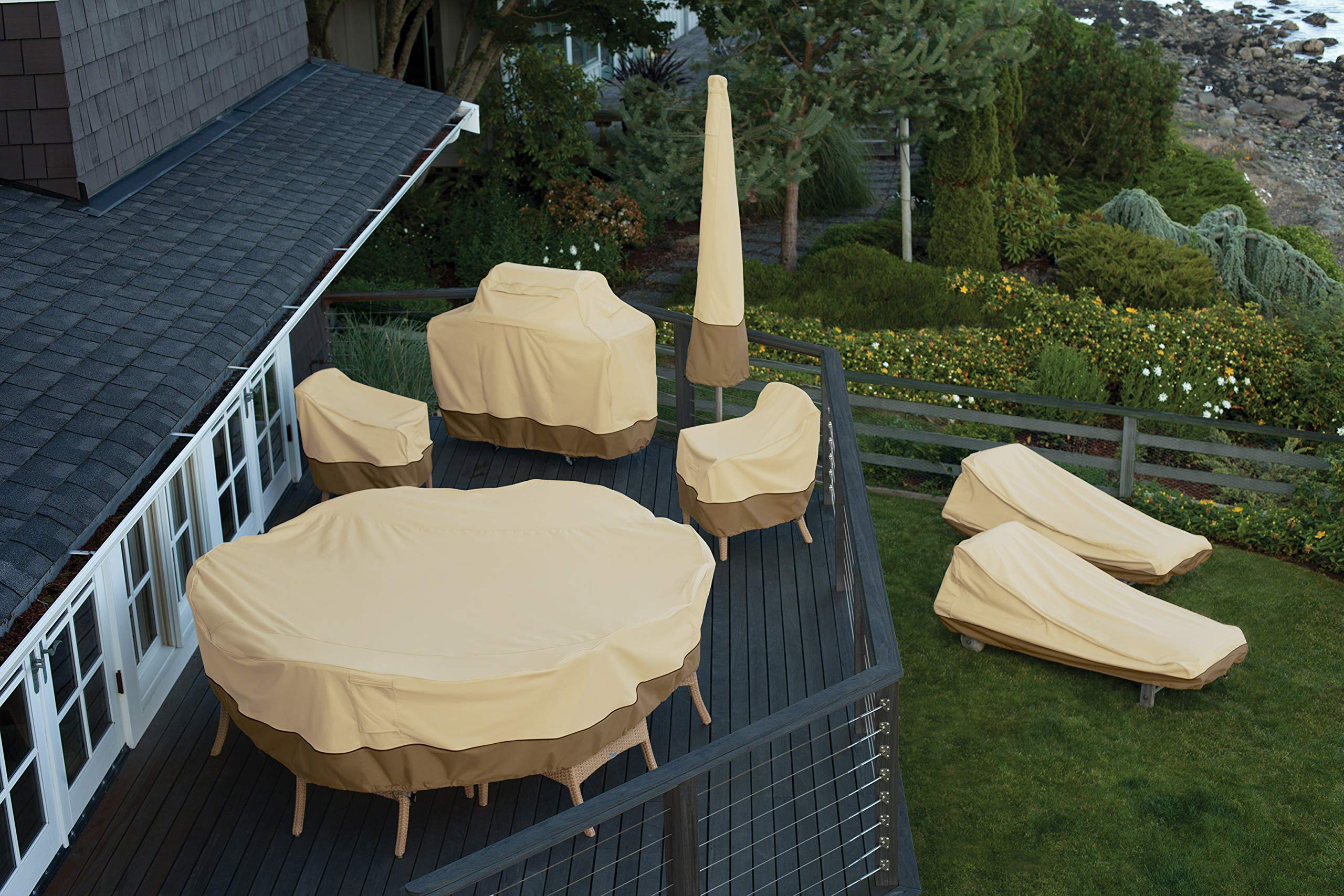 Classic Accessories Veranda covering a fire pit table in a patio setting for year-round protection