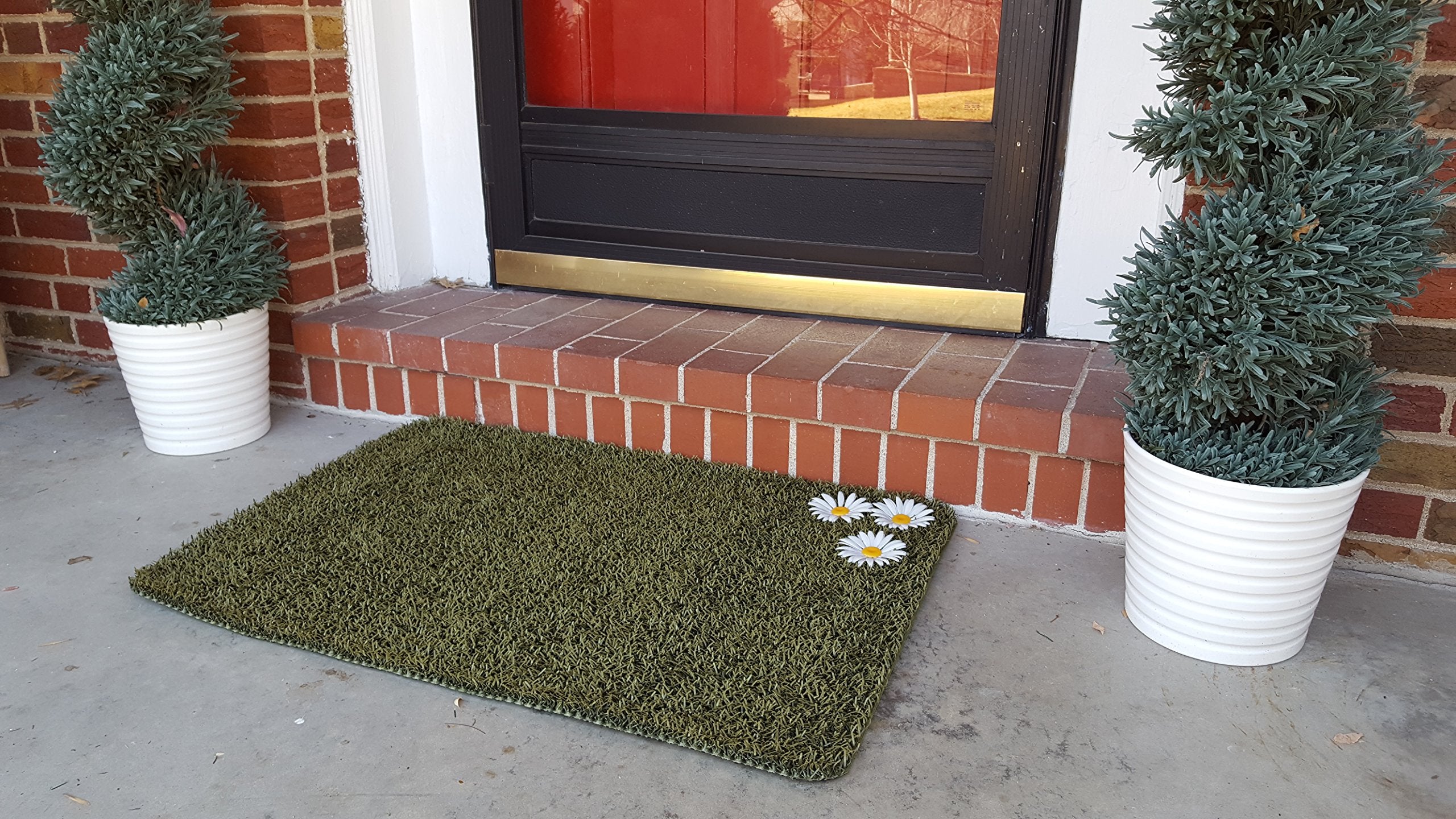 CLEAN MACHINE mat in use at front porch trapping mud from boots effectively