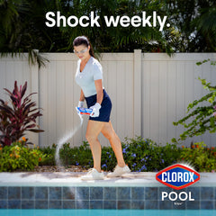 Clorox Pool&Spa pouring granules into pool deep end for quick treatment