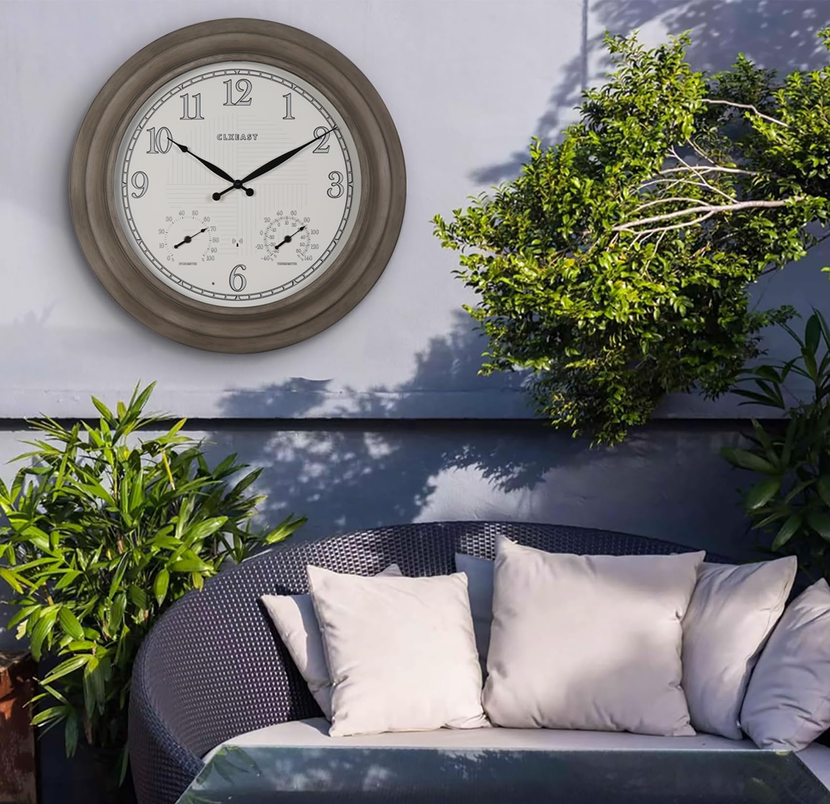 CLXEAST clock on patio showing size comparison and outdoor placement benefit