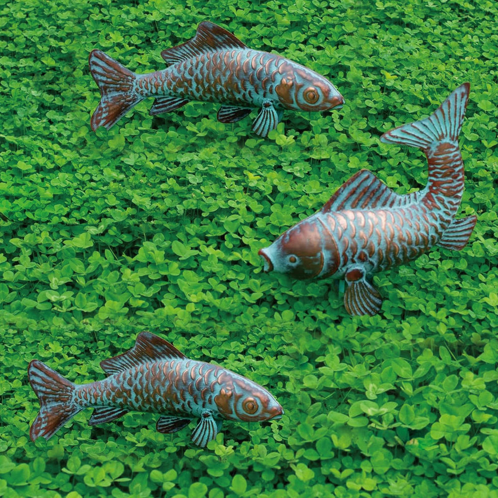 CLYB front view of three koi statues, shows elegant garden focal point