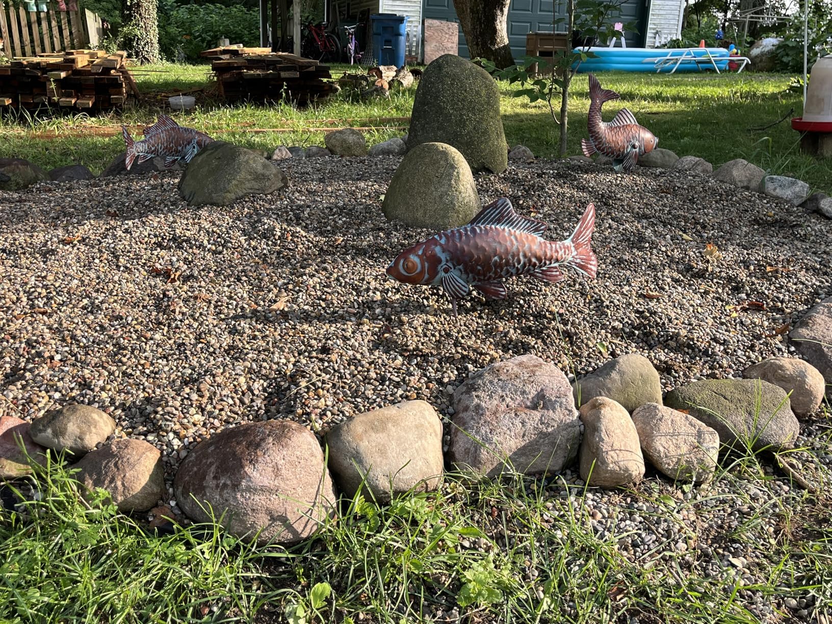 CLYB grouped trio on lawn, creates layered visual interest in garden