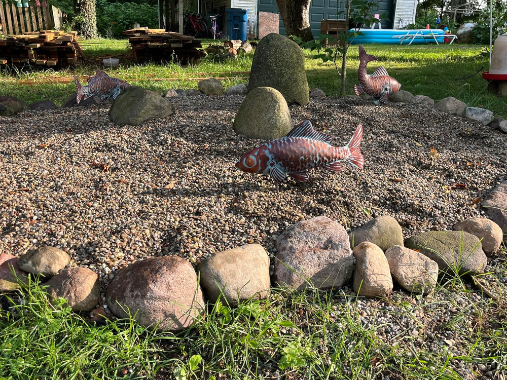 CLYB grouped trio on lawn, creates layered visual interest in garden