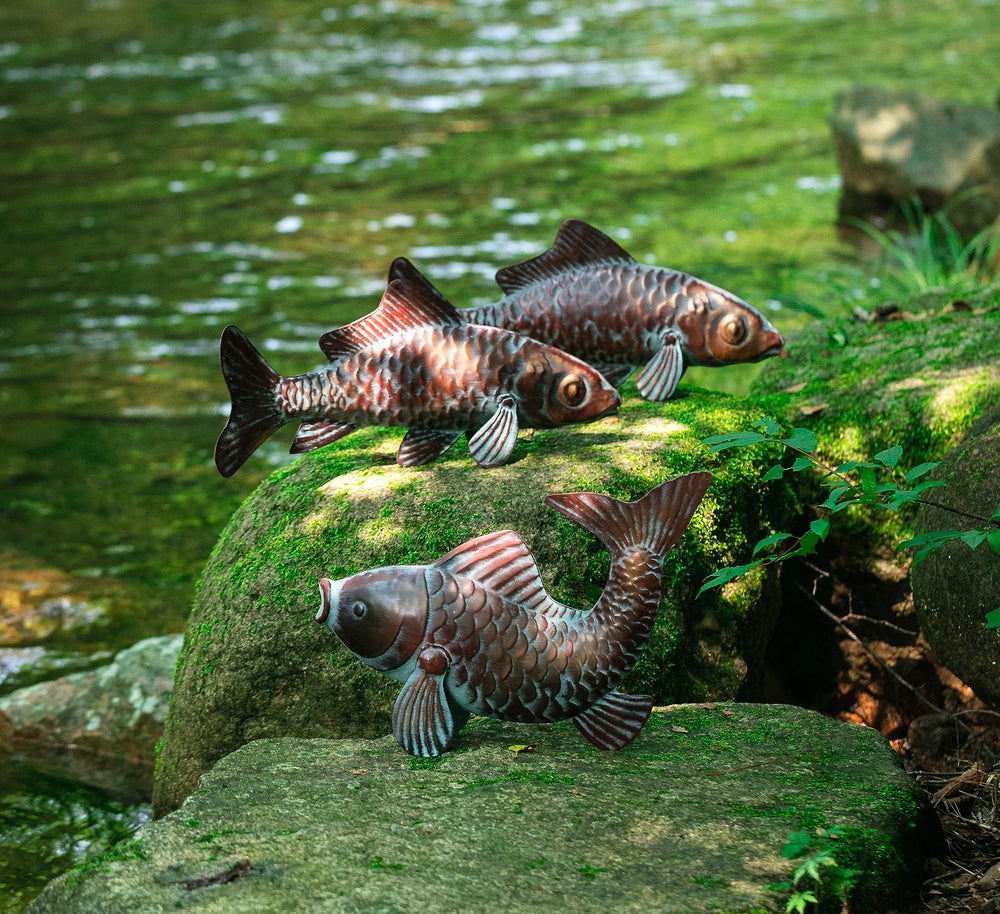 CLYB koi sculpture at pond edge, adds refined aquatic accent to landscape
