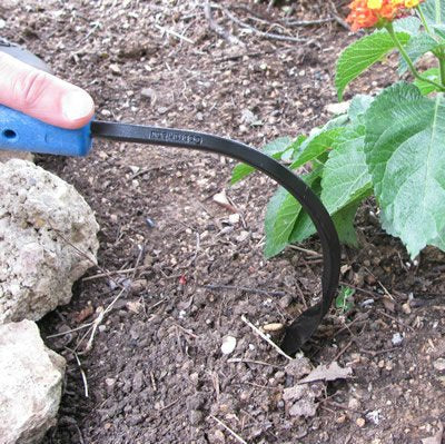 CobraHead held in hand for scale showing compact size and control