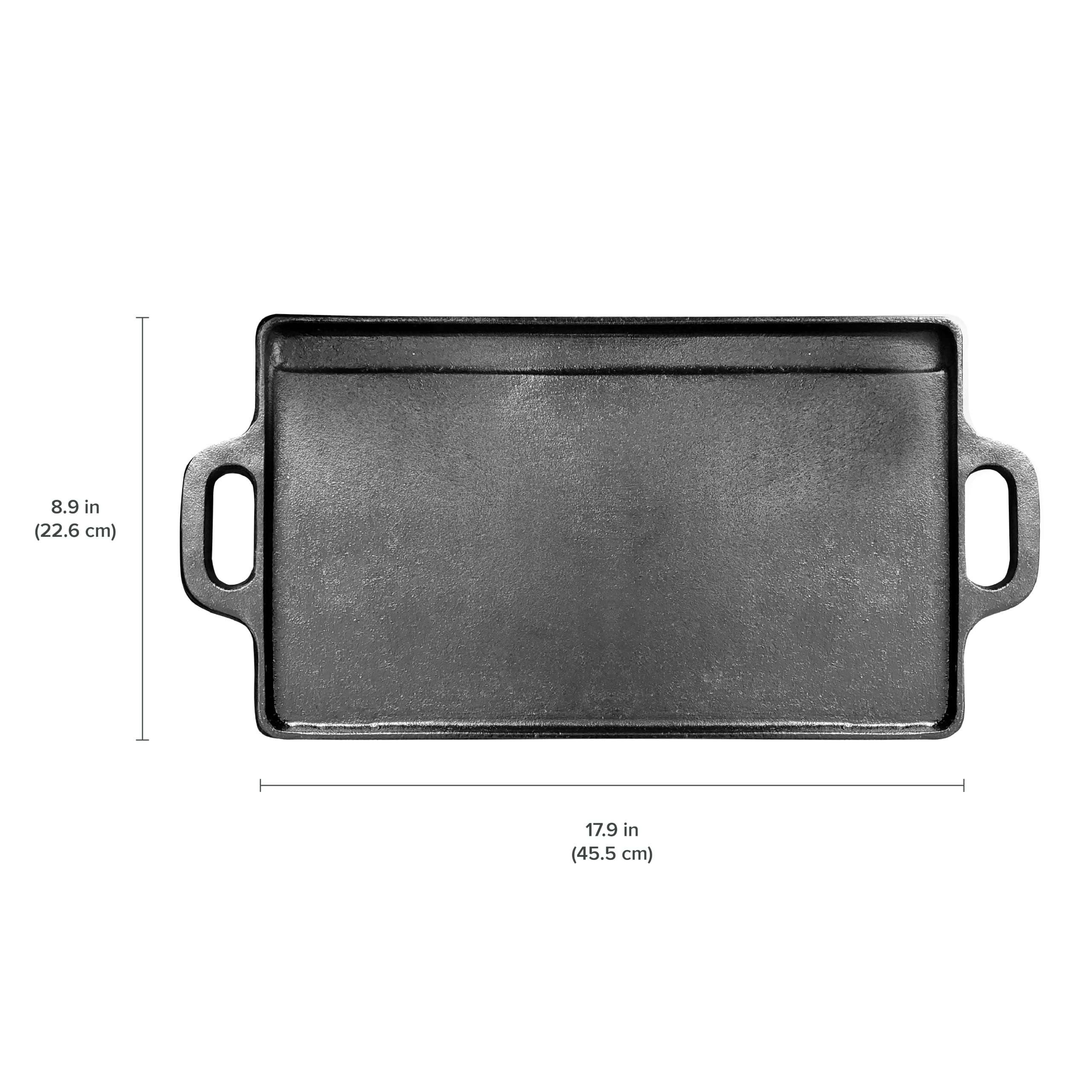 Coghlan's griddle beside hand for scale illustrating generous 18x9 inch capacity