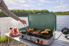 Coleman Cascade accessories next to hand showing compact carry case portability