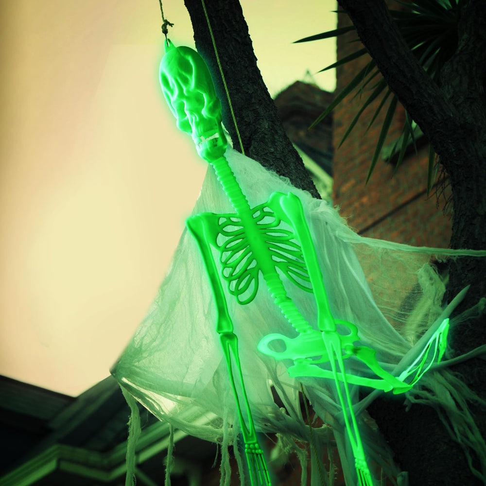 Colingmill skeletons in a yard scene adding eerie atmosphere to Halloween display