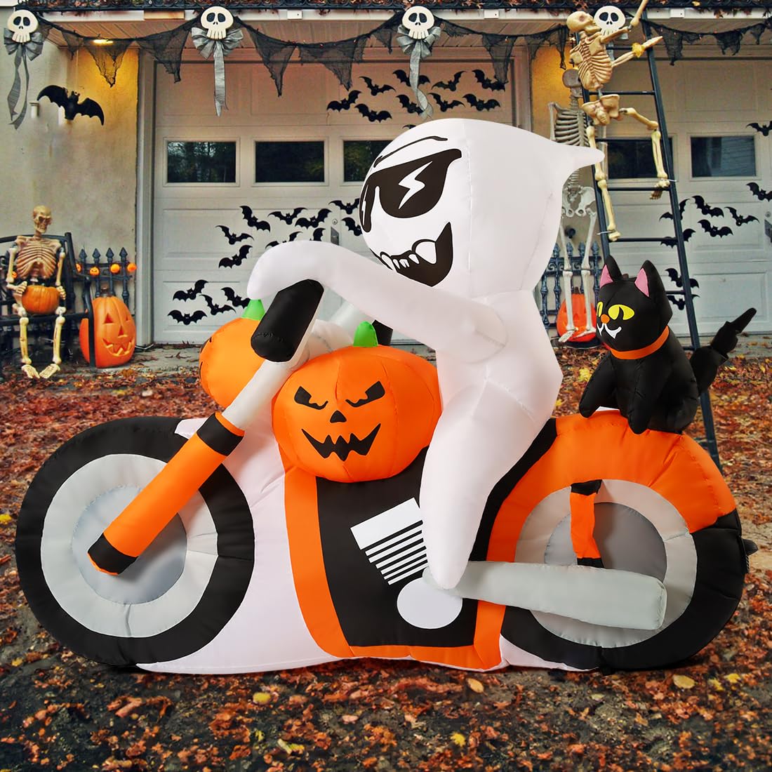 COMIN detail of pumpkin and black cat on motorcycle, adding playful seasonal charm