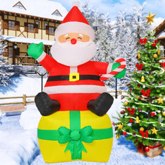 COMIN Santa inflatable lit by built-in LEDs glowing warmly at night